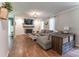 Inviting living room with fireplace, hardwood flooring, natural light, and a comfortable sectional sofa at 361 Princeton Way, Lawrenceville, GA 30044