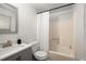 Bathroom with a gray vanity and shower-tub combo at 3992 Joshua Ln, Douglasville, GA 30135