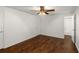Bedroom with hardwood floors, a ceiling fan, and an ensuite bathroom at 3992 Joshua Ln, Douglasville, GA 30135