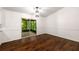 Bright dining area featuring hardwood floors and sliding glass doors to the screened porch at 3992 Joshua Ln, Douglasville, GA 30135