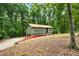 Charming single-story home nestled in a lush, wooded lot offering both privacy and curb appeal at 3992 Joshua Ln, Douglasville, GA 30135