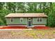Inviting single-story home featuring a modern front door and well-maintained landscaping at 3992 Joshua Ln, Douglasville, GA 30135