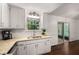 Updated kitchen featuring granite countertops, white cabinets and stainless steel appliances at 3992 Joshua Ln, Douglasville, GA 30135