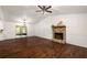 Bright living room featuring hardwood floors, a stone fireplace and access to a patio at 3992 Joshua Ln, Douglasville, GA 30135