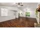 Large living room with hardwood floors leading to a kitchen and a screened patio at 3992 Joshua Ln, Douglasville, GA 30135