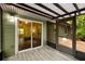 View of the screened porch with wood ceiling and exterior access to the backyard at 3992 Joshua Ln, Douglasville, GA 30135
