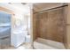 Bathroom featuring a tiled shower, classic vanity, and fixtures at 879 Sylvan Sw Pl, Atlanta, GA 30310