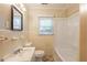 Classic bathroom featuring a tub, sink, mirror, and a window at 879 Sylvan Sw Pl, Atlanta, GA 30310