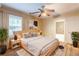 Comfortable bedroom with a ceiling fan, neutral tones and a bright window at 879 Sylvan Sw Pl, Atlanta, GA 30310