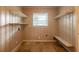 Functional closet space with built-in shelves and a window for ventilation at 879 Sylvan Sw Pl, Atlanta, GA 30310