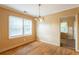 Bright dining room with hardwood floors, chandelier, and plenty of natural light at 879 Sylvan Sw Pl, Atlanta, GA 30310
