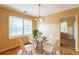 Cozy dining area with a glass table set and bright window view at 879 Sylvan Sw Pl, Atlanta, GA 30310