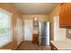 Efficient kitchen layout with modern refrigerator, ample counter space, and natural light at 879 Sylvan Sw Pl, Atlanta, GA 30310