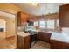 Functional kitchen featuring wood cabinets, stainless steel sink, and durable appliances at 879 Sylvan Sw Pl, Atlanta, GA 30310