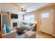 Stylishly staged living room with hardwood floors, fireplace, and comfortable seating at 879 Sylvan Sw Pl, Atlanta, GA 30310