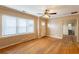 Open-concept living room boasts bright windows and hardwood floors, creating a warm and inviting atmosphere at 879 Sylvan Sw Pl, Atlanta, GA 30310