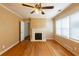 Spacious living room featuring original hardwood floors and cozy fireplace, great for relaxing at 879 Sylvan Sw Pl, Atlanta, GA 30310