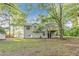 Spacious backyard view showing the home's exterior and sprawling lawn at 733 Wesley Chapel Rd, Villa Rica, GA 30180