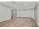 Finished basement with vinyl flooring and neutral paint at 733 Wesley Chapel Rd, Villa Rica, GA 30180