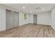 Finished basement has vinyl flooring, recessed lighting, and windows at 733 Wesley Chapel Rd, Villa Rica, GA 30180