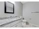 This bathroom has a vanity with a granite countertop at 733 Wesley Chapel Rd, Villa Rica, GA 30180