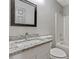 Bathroom with a granite vanity countertop and large mirror at 733 Wesley Chapel Rd, Villa Rica, GA 30180