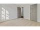 This bedroom has neutral carpet and a door leading to another room at 733 Wesley Chapel Rd, Villa Rica, GA 30180