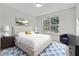 Cozy bedroom featuring a window with natural light, neutral carpet and stylish decor at 733 Wesley Chapel Rd, Villa Rica, GA 30180