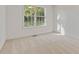 Bright bedroom with neutral carpet and a large window providing plenty of natural light at 733 Wesley Chapel Rd, Villa Rica, GA 30180