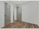 Secondary bedroom with vinyl flooring and two doors at 733 Wesley Chapel Rd, Villa Rica, GA 30180