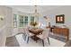 Bright and airy dining room featuring bay windows and a chandelier at 733 Wesley Chapel Rd, Villa Rica, GA 30180