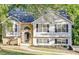 Charming split-level home featuring stone accents, neutral siding and a well-maintained front yard at 733 Wesley Chapel Rd, Villa Rica, GA 30180