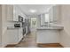 Modern kitchen with white cabinets, granite countertops, and stainless steel appliances at 733 Wesley Chapel Rd, Villa Rica, GA 30180