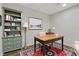 Office with a desk, chair, bookshelf and decorative rug at 733 Wesley Chapel Rd, Villa Rica, GA 30180