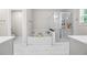 Serene bathroom with a soaking tub, separate shower, and elegant tile work at 774 Belrose Dr, Smyrna, GA 30080