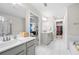 Modern main bathroom with double sinks, a soaking tub, and a separate glass-enclosed shower at 774 Belrose Dr, Smyrna, GA 30080