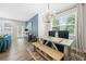 Inviting dining area with a modern table setting and natural light from large windows at 774 Belrose Dr, Smyrna, GA 30080