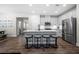 Bright, modern kitchen with stainless steel appliances, a large island, and hardwood floors at 774 Belrose Dr, Smyrna, GA 30080