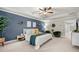 Comfortable main bedroom with tray ceilings, neutral walls, and views of the backyard at 774 Belrose Dr, Smyrna, GA 30080