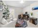 Bright and inviting home office with white chairs, modern rug, desk, and private balcony access at 774 Belrose Dr, Smyrna, GA 30080