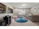 A comfortable recreation room with daybed, modern rug, minibar, and natural light at 774 Belrose Dr, Smyrna, GA 30080