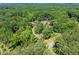 Beautiful aerial view of the house nestled among lush green trees at 1572 Azalea Dr, Lawrenceville, GA 30043