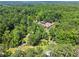 Aerial view of the property featuring a long, gated driveway at 1572 Azalea Dr, Lawrenceville, GA 30043