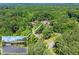 Expansive property with a long driveway winding through lush greenery, ensuring privacy and tranquility at 1572 Azalea Dr, Lawrenceville, GA 30043