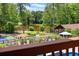 View of the backyard, pool, lake, and chapel at 1572 Azalea Dr, Lawrenceville, GA 30043