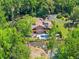 Stunning backyard with a sparkling pool, lush landscaping, and a beautiful patio area for outdoor entertaining at 1572 Azalea Dr, Lawrenceville, GA 30043
