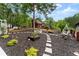 Charming backyard with patio, garden, and play areas, perfect for outdoor entertaining and relaxation at 1572 Azalea Dr, Lawrenceville, GA 30043