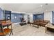 Basement features multiple seating areas, bar area and exercise equipment at 1572 Azalea Dr, Lawrenceville, GA 30043