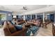 Basement with multiple seating areas, bar area and exercise equipment at 1572 Azalea Dr, Lawrenceville, GA 30043