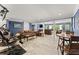 Finished basement with exercise equipment, multiple seating areas, and tiled floors at 1572 Azalea Dr, Lawrenceville, GA 30043